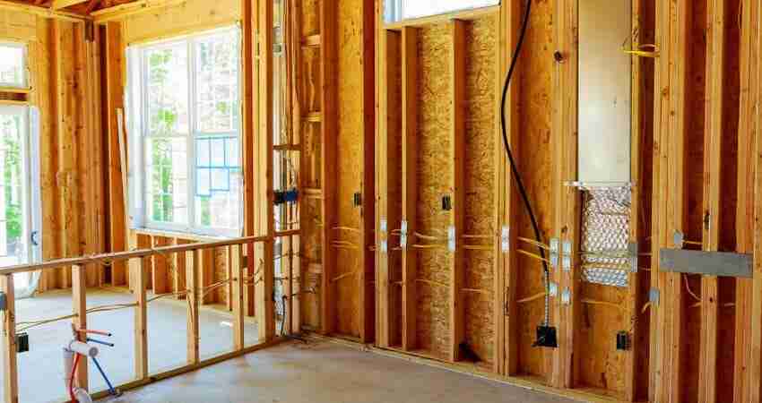 framed home before dry wall installed showing basic wiring