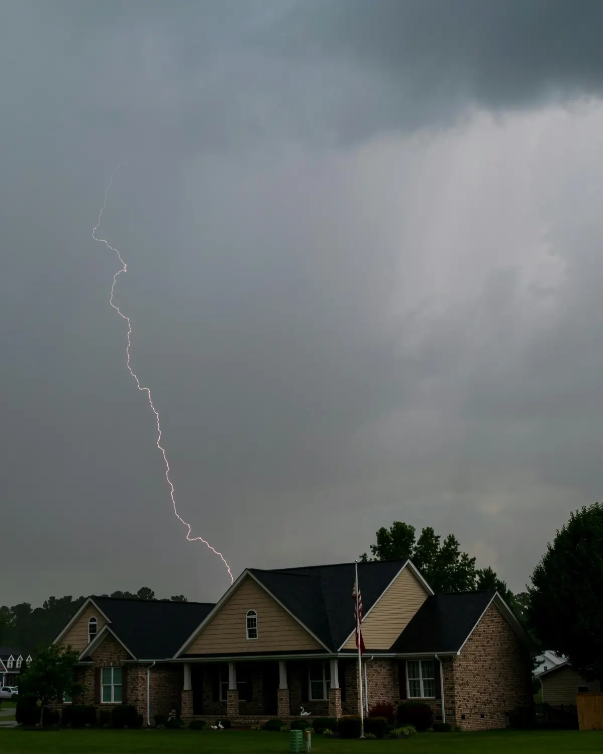 Lightning strike near suburban home